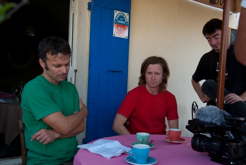 Matching coffee cups for a piece to camera in Vaisone la Romaine as location manager Luca looks on approvingly