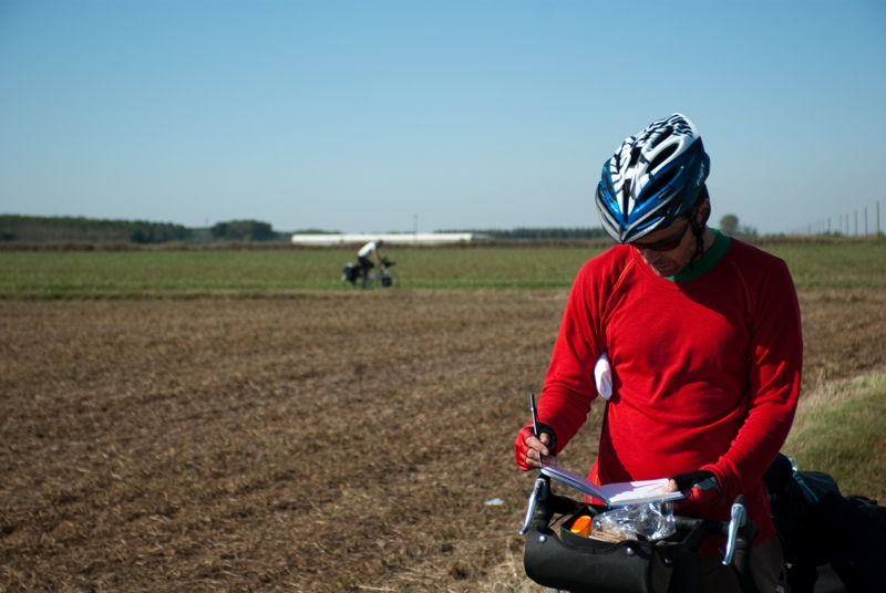 Danny taking notes, Ben doing bikecam! On the plains bewtween Pavia and Piacenza